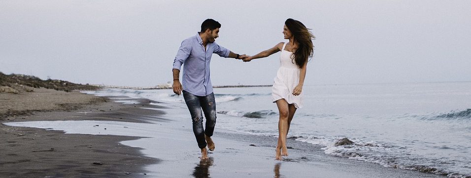 Couple Holding Hands on the beach